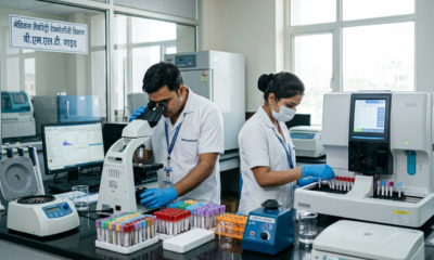 Indian lab technicians working in a modern BMLT course laboratory, using a microscope and a blood analyzer.